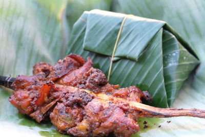 Close-up of meat on barbecue grill