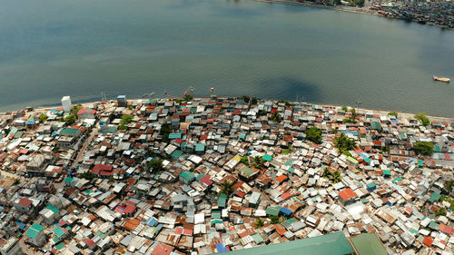 Dense building houses in the slums of manila top view. overpopulated poor area.