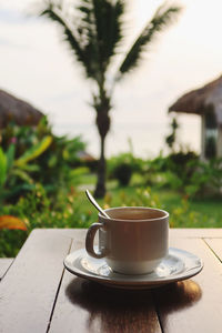 Close-up of coffee cup on table