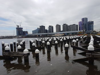 Row of city skyline against sky