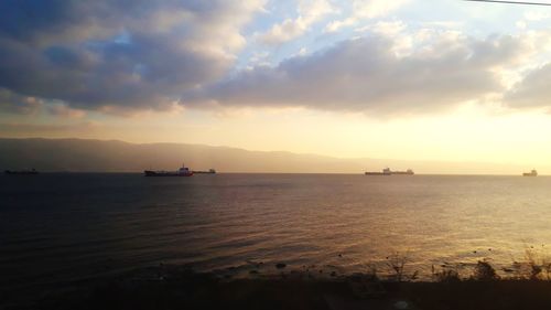 Scenic view of sea against sky at sunset