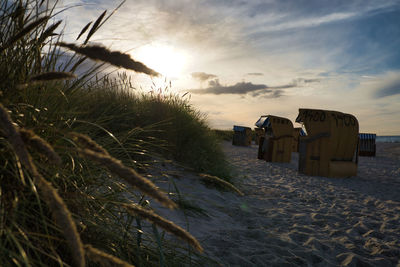 Scenic view of beach against sky during sunset