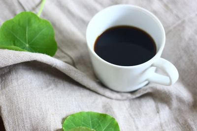 High angle view of coffee cup on table