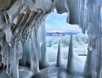 Icicles on snow covered landscape