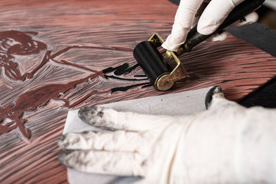 Close-up of man working on table