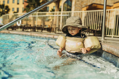 Boy in swimming pool