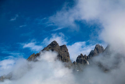 Low angle view of rocks against sky