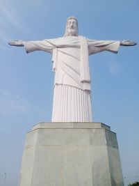 Low angle view of statue against sky