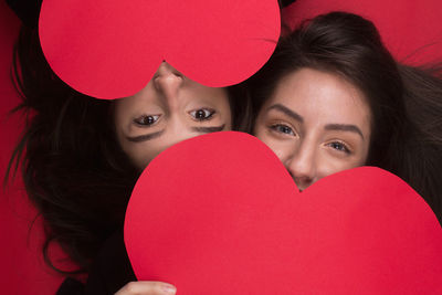 Portrait of beautiful woman with heart shape