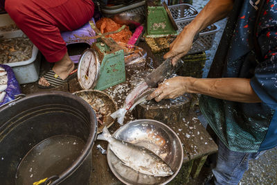 Midsection of man preparing food