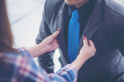 Midsection of man holding hands