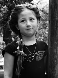Portrait of cute girl standing outdoors