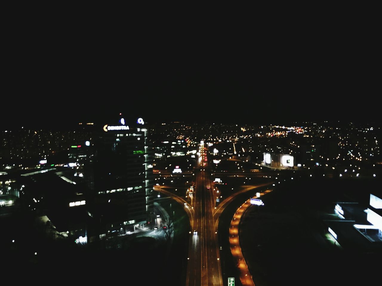 night, illuminated, architecture, city, built structure, building exterior, cityscape, copy space, clear sky, dark, high angle view, city life, crowded, no people, sky, lighting equipment, outdoors, residential district, residential building, light - natural phenomenon