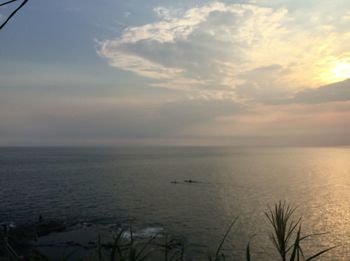 Scenic view of sea against sky at sunset