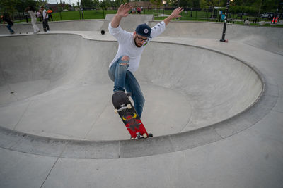 Full length of man skateboarding on skateboard