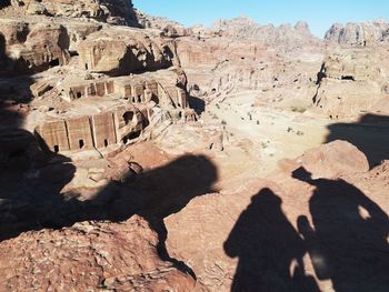 Shadow of people on rock