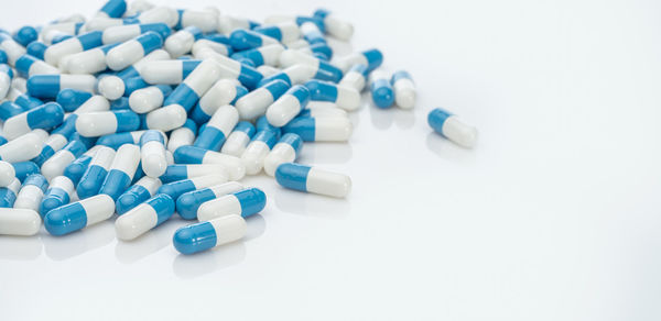 Close-up of capsules on white background