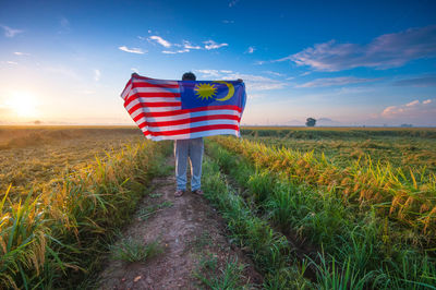 Man standing on grassy field