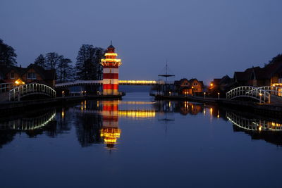 Reflection of illuminated buildings in water at night