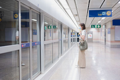 Solo asian woman wearing protective mask during transport to work or travel