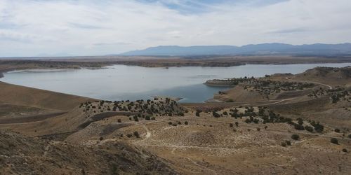 Panoramic view of desert against sky