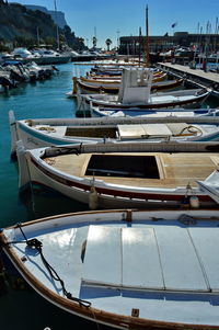 Boats moored at harbor