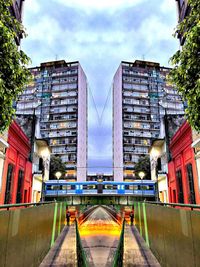 Digital composite image of street and buildings against sky