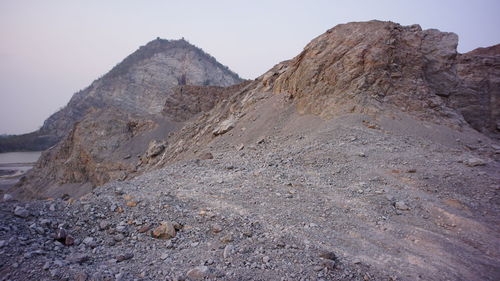 Rock formation on land against sky