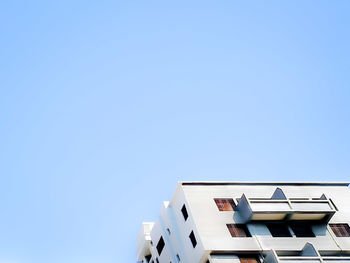 Low angle view of buildings against clear sky