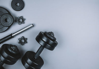 High angle view of machine on table against white background