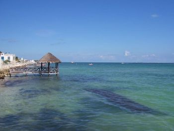 Scenic view of sea against blue sky