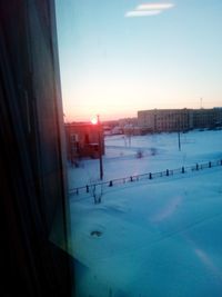 View of swimming pool in city during winter