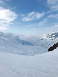 Scenic view of mountains against sky during winter