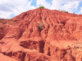 Low angle view of rock formation against sky