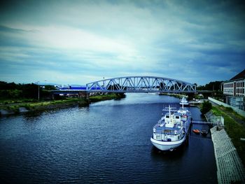 View of bridge over river in city