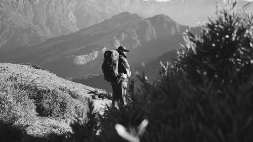 Man standing by mountains