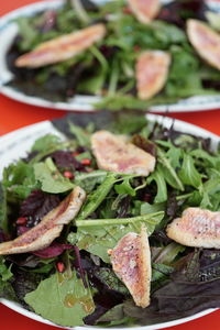 High angle view of salad with red mullet on table