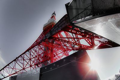 Low angle view of sun shining through clouds