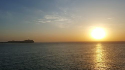 Scenic view of sea against sky at sunset