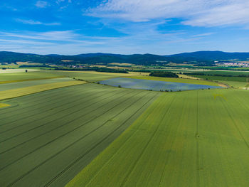 Scenic view of fields against sky