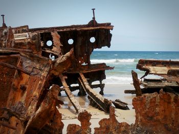Abandoned boat in sea