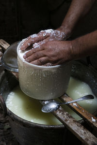 Cropped image of man making cheese with his hands