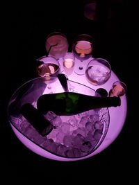 High angle view of electric lamp on table against black background
