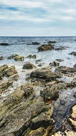 Scenic view of calm sea against sky