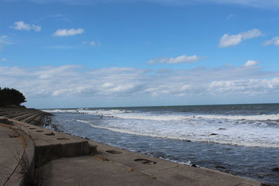 Scenic view of beach against sky