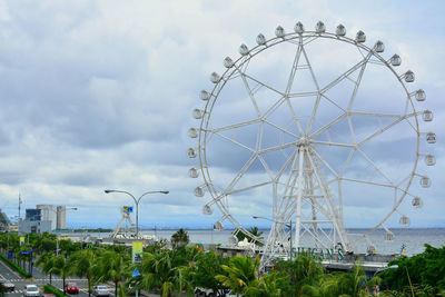 Low angle view of ferris wheel against sky