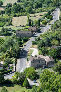 High angle view of road amidst trees in city