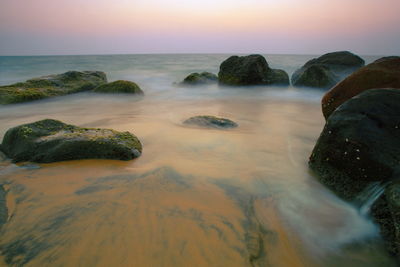 Scenic view of sea against sky at sunset