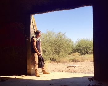 Man standing in front of wall