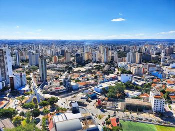 High angle view of buildings in city against sky